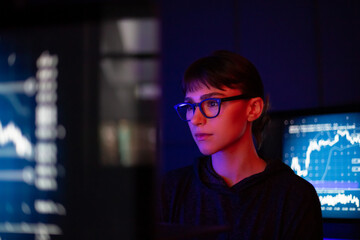 Female working on a computer trading in a futuristic style
