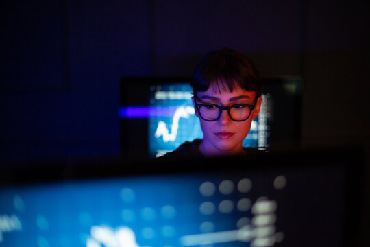 Female working on a computer trading in a futuristic style