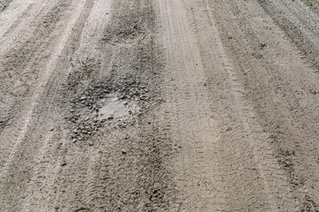 Dirt road with holes and potholes