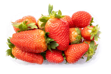 top view of whole red strawberries in a plastic tray