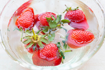 Fresh and Juicy beautiful organic strawberries on wooden background.Top view point.