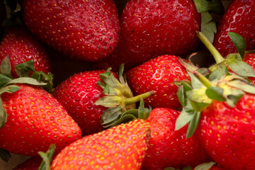 Fresh and Juicy beautiful organic strawberries on wooden background.Top view point.