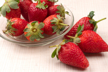 Fresh and Juicy beautiful organic strawberries on wooden background.Top view point.