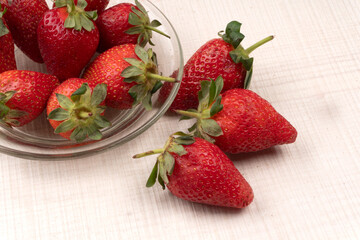 Fresh and Juicy beautiful organic strawberries on wooden background.Top view point.