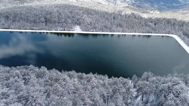 Rectangular lake in winter in the Troodos mountains in Cyprus