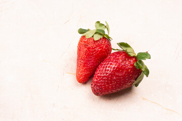 Fresh and Juicy beautiful organic strawberries on wooden background.Top view point.