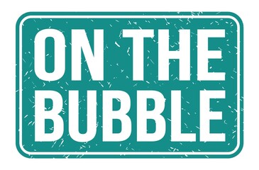 ON THE BUBBLE, words on blue rectangle stamp sign
