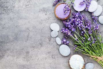 Fototapeten Essential lavender salt with flowers top view. © gitusik