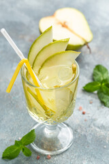 Fresh cocktail or mocktail with pear, ice. low alcohol drink, Refreshing drink in the garden