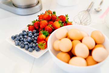 strawberries and blueberries on plate to decorate desserts.