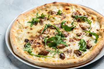 Pear, blue cheese, walnut and arugula pizza with honey. Food recipe background. Close up