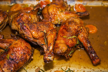 Baked duck drumsticks close up.