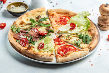 pizza set with different pieces of stuffing, slices of pizza margherita. Pizza margarita and hand close up. Food recipe background