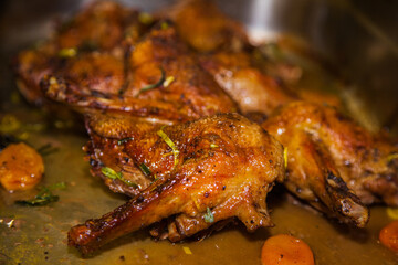Baked duck drumsticks close up.