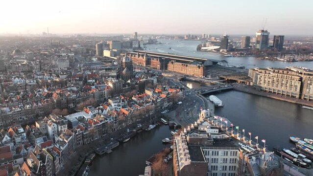 Amsterdam downtown city center central station landmark in The Netherlands. Historic european urban panoramic capital streets canals houses infrastructure and architecture.