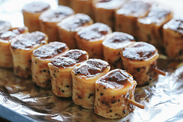 Shashlik or shish kebab prepared on barbecue grill over hot charcoal with grilled vegetables. Grilled pieces of pork meat on metal skewers.