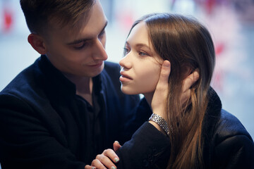 Fototapeta premium guy hugging pretty girlfriend