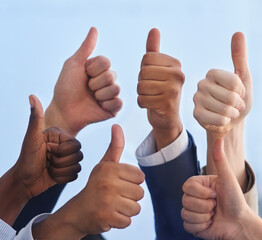 Amazing work. Cropped shot of a group of businesspeople showing a thumbs up gesture.