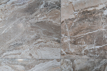 Tile on the floor is brown with a pattern of background texture. Granite tile stone ceramic tile.