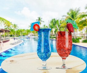 Breakfast in swimming pool in luxurious tropical resort. Tropical couple beach luxury lifestyle