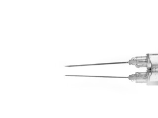 syringe with needle on white background, reflection in the base - macro photography, lot of detail
