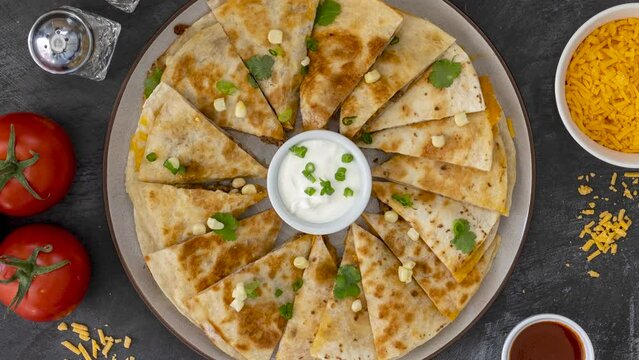 Rotating Quesadilla with Sour Cream Shot from Above