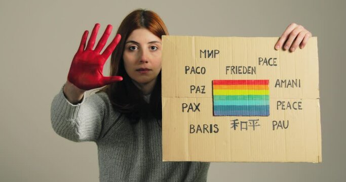 Ukrainian girl holding an anti-war placard in her hand