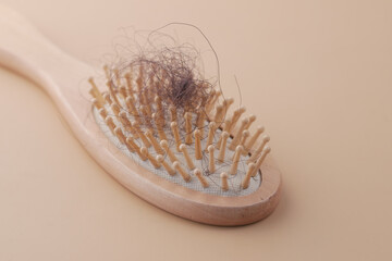 a brush with lost hair on table 