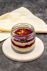 Magnolia Dessert . Fruity Magnolia. Stewed magnolia dessert in glass cup on dark background