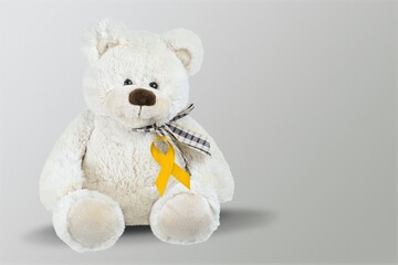 International Childhood Cancer Awareness month, Children toy with golden Ribbon for supporting