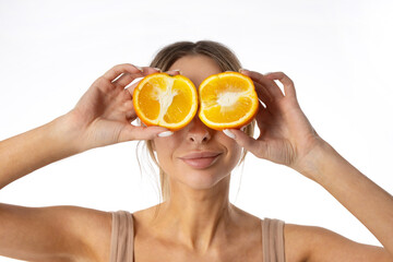 portrait of a cute attractive female with oranges	
