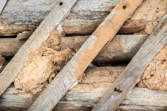 Vintage and old rustic fence with wood and clay. High detailed background photo