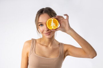 portrait of a cute attractive female with oranges	
