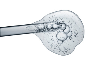 Liquid gray transparent gel or serum with dropper pipette on white isolated background