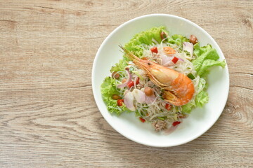 glass noodle with shrimp and chop pork spicy salad on plate