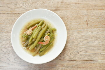 fried slice lotus stems with shrimp on plate
