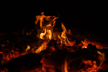 Bonfire winter dark night, view from top. Flame sores rise into lens. Roast oneself at fire on black backgroung isolated