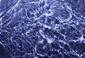 Splash cosmetic moisturizer water micellar toner or emulsion blue colored abstract background