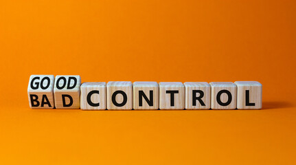 Bad or good control symbol. Turned wooden cubes and changed words bad control to good control. Beautiful orange table orange background. Business good or bad control concept. Copy space.