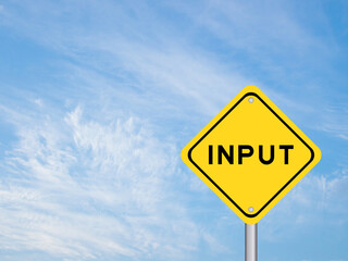 Naklejka premium Yellow transportation sign with word input on blue color sky background