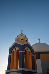 The beautiful  and picturesque chapel in Fira Santorini and a deep blue sky 