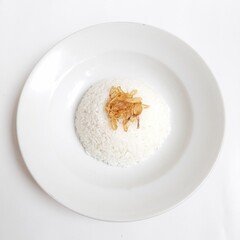 Rice with fried onions in a plate on a white background