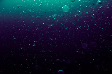 air bubbles rising from dater, abstract dark background