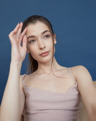 Fototapeta premium Brunette model posing in studio fashion style