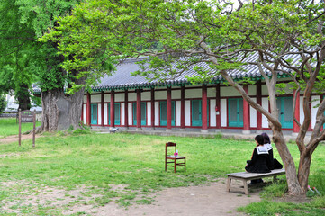Tourists wearing school uniforms taking pictures at Jeonju Local Confucian School in Jeonju, Korea.