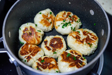 A plate of golden and tempting fresh pork fried buns