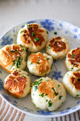 A plate of golden and tempting fresh pork fried buns