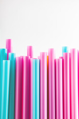 Multicolored blue yellow pink fuxia straws background retro 60's 50's 80's
