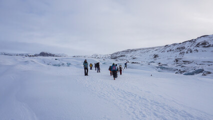 Fototapeta na wymiar A group of people at a glacial trekking