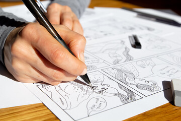 Storyboard of comic book characters drawn by the artist on paper sheets.